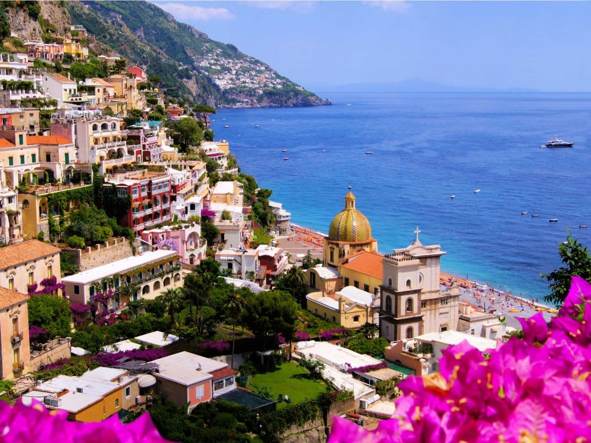 hug the cliffs while driving along the amalfi coast in italy and visit the charming towns of positano ravello and salerno