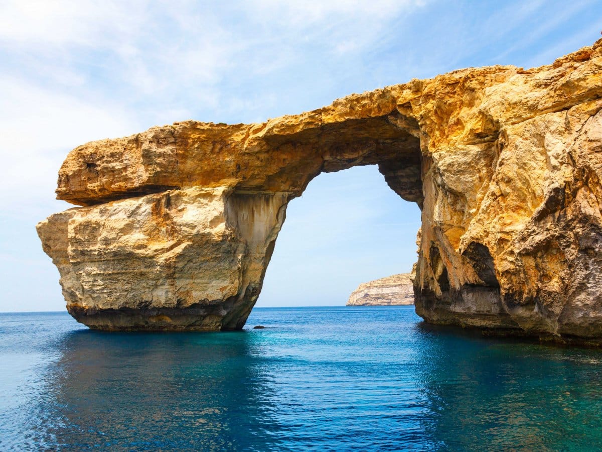 snap a photo at the azure window a natural limestone arch on the maltese island of gozo