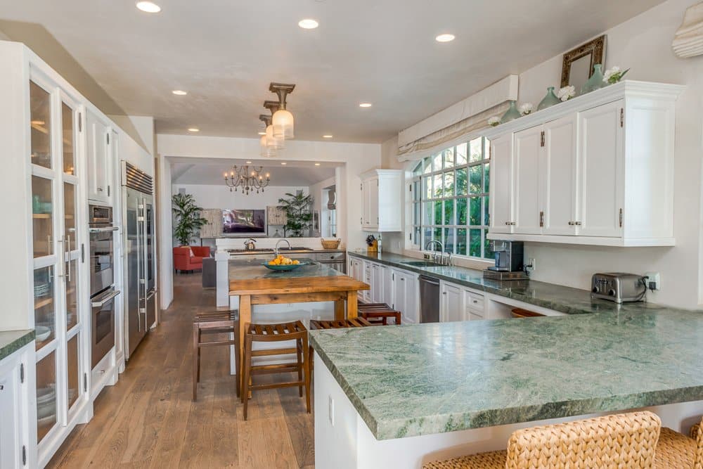 The chef's kitchen has plenty of counter space and natural light.