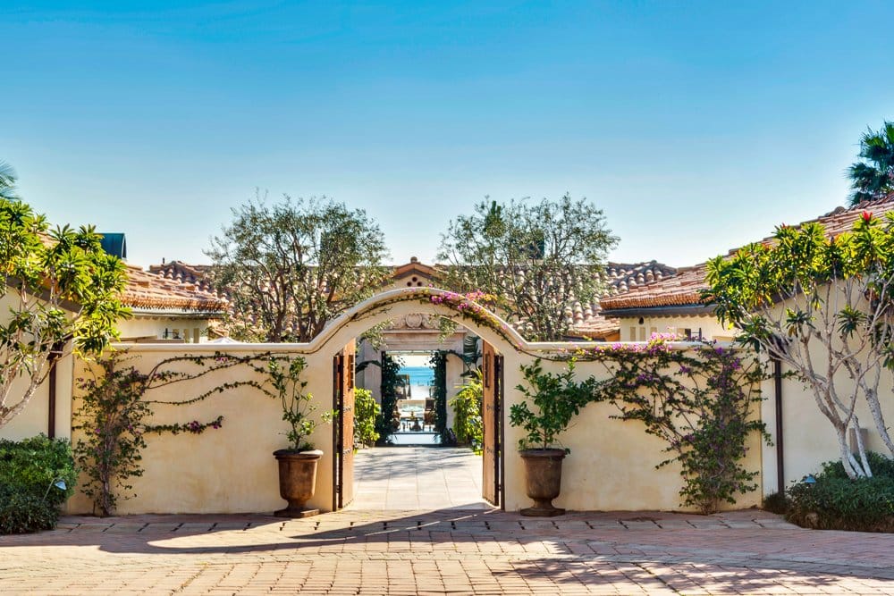 The home sits on 1.5 acres of land and has a gorgeous gate welcoming guests into the home.