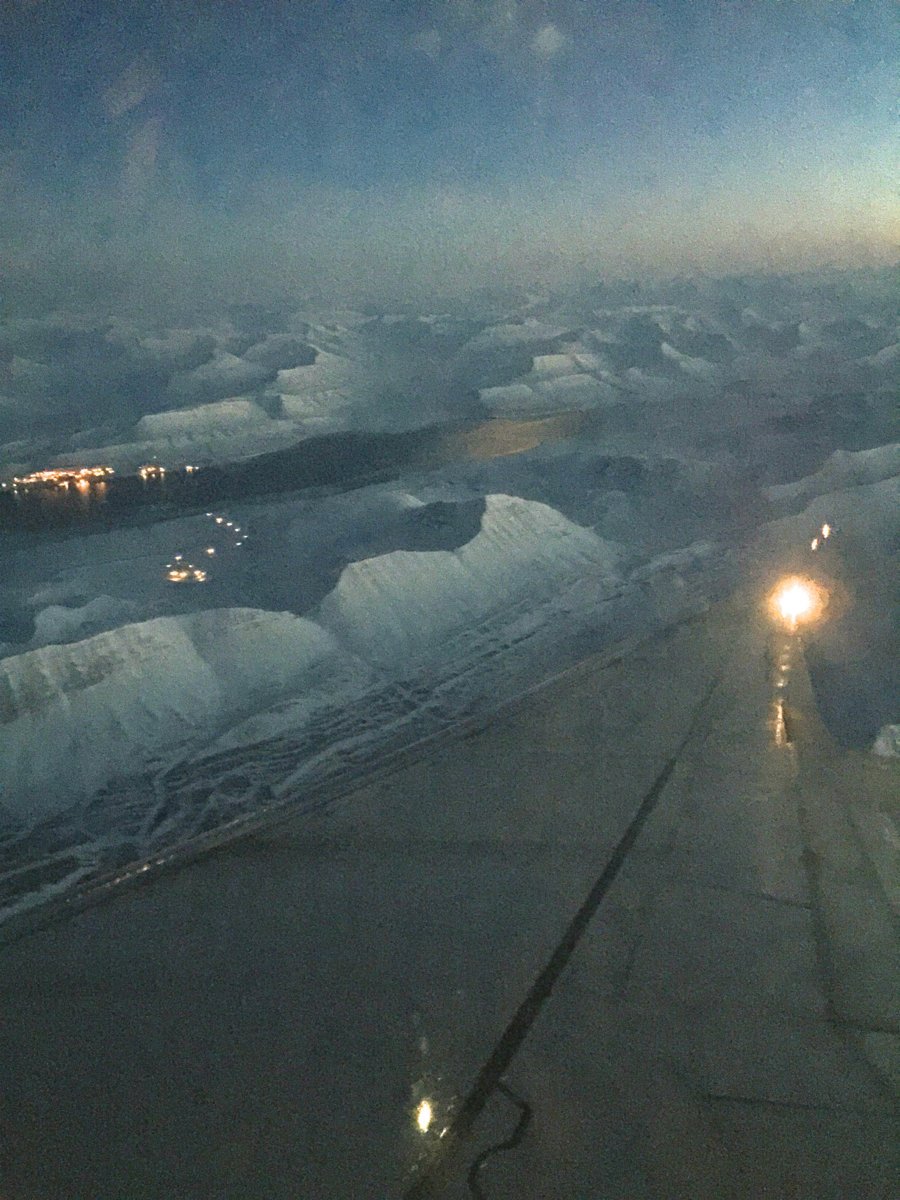 behold the dramatic and rugged coastline of the island of spitsbergen bathed in eternal night at this time of year i lightened the photo so you could see the view