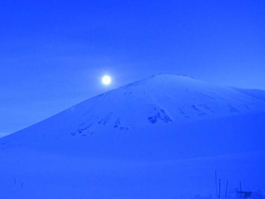 the smell was nauseating but the view was not the moon over the glacial mountains