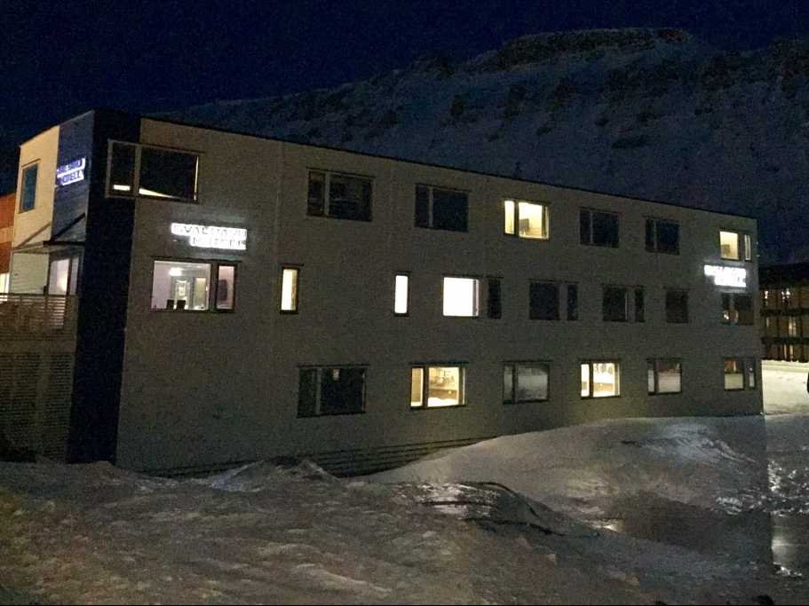 this is my hotel in town longyearbyen means longyear city the town was actually founded by an american named john longyear who set up a mining operation for around 500 people here in the early 1900s