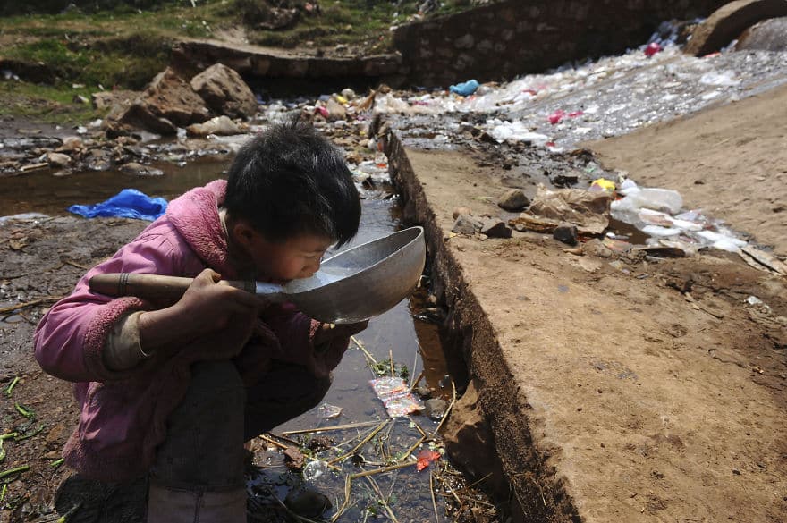 A child drinks water near a stream in Fuyuan county, Yunnan province March 20, 2009. World Water Day will be observed on March 22. Picture taken March 20, 2009. (Photo by Reuters/Stringer)