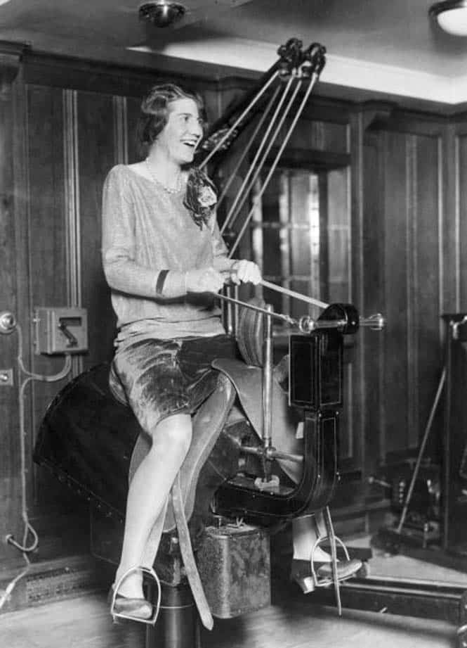 A young woman passenger enjoying herself riding the electric horse in the gym on the liner SS Bermuda, mid 1920s. (Photo by Underwood Archives/Getty Images)