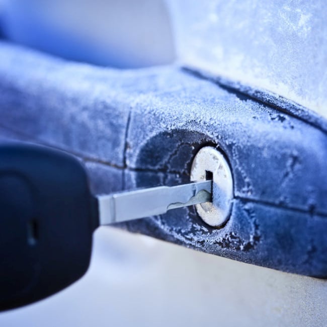Unlocking car door in winter.