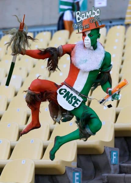 An Ivory Coast supporter leaps in the air as he enters the stands ahead of their African Cup of Nations group D match with Tunisia Saturday, Jan. 26 2013 at the Royal Bafokeng stadium in Rustenburg, South Africa. The two other teams in group D are Togo and Algeria. (AP Photo/Armando Franca)