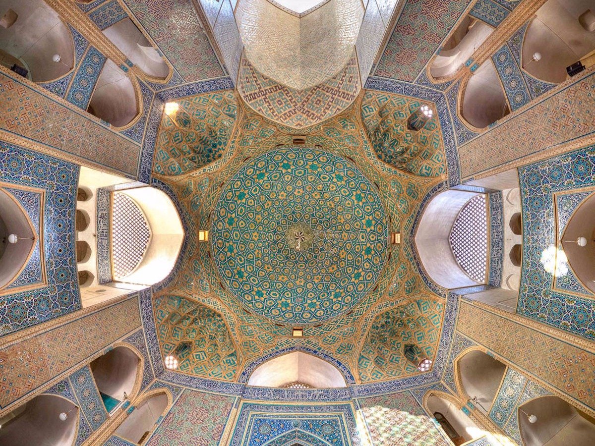 located-in-the-yazd-province-the-awe-inspiring-jameh-mosque-is-home-to-one-of-irans-tallest-entrances-two-minarets-bearing-inscriptions-from-the-15th-century-soar-over-150-feet