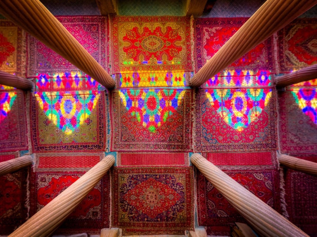 reflections-from-the-stained-glass-windows-dance-over-beautiful-rugs