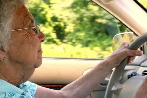 Senior Citizen Woman Driving in Profile
