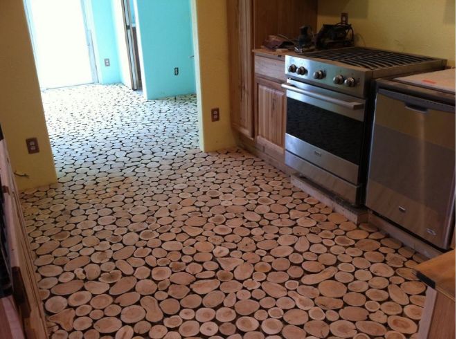 DIY-Old-Surface-Floor-Made-Into-a-Natural-Cordwood-Floor-4