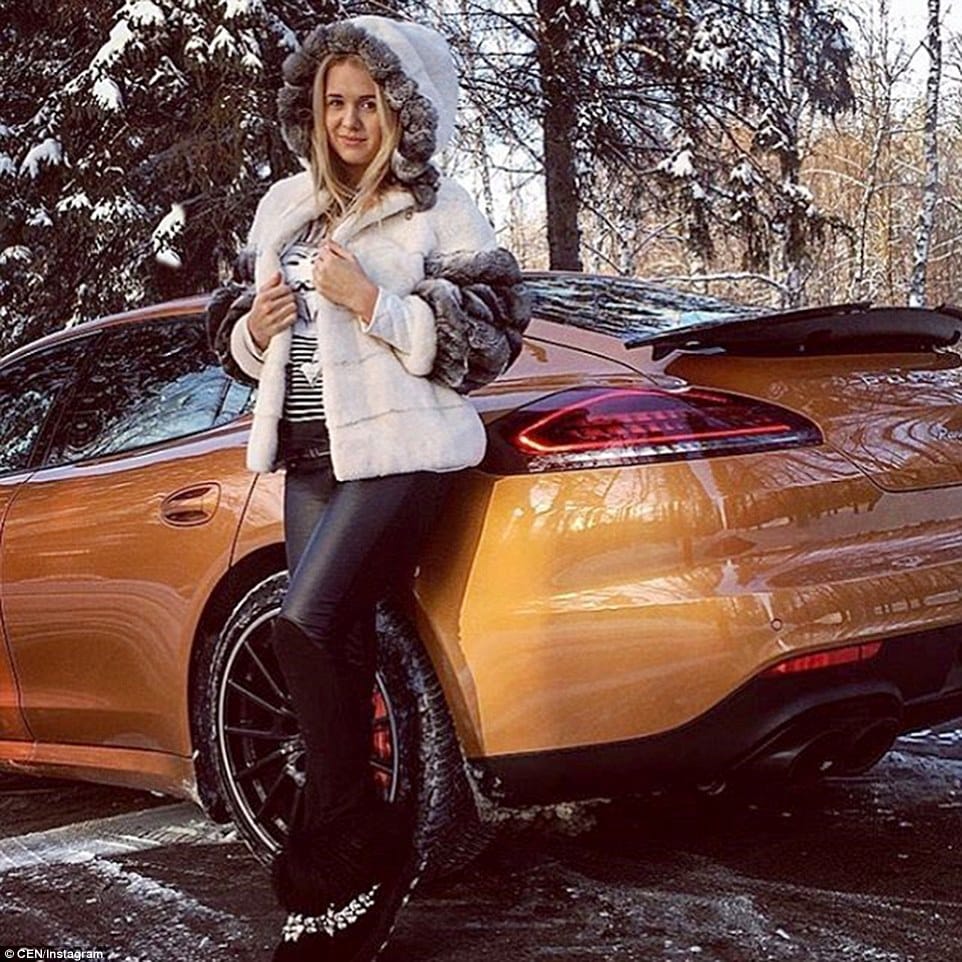 317398B500000578-0-A_woman_poses_next_to_gold_coloured_Porsche_in_one_of_the_photog-a-154_1456161830229
