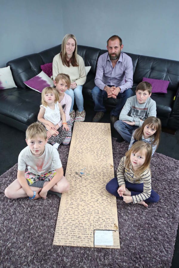 PIC FROM CATERS NEWS - (PICTURED: Harley 8, Letissia-Dior 2, Porscha 10, mum Caroline, Dad Dean, Ethan 11, Tiana 5,Indika-Mayah 4) - A 12-year-old girl who died following a battle with cancer left a heart-wrenching secret message hidden on the back of her mirror. Athena Orchard, died last Wednesday (May 28) after losing her fight with the terminal disease. Just days after her death, Athenas dad Dean was stunned to discover a giant heartfelt note written in marker pen on the back of his daughters mirror. The message was written after Athena was diagnosed with cancer - which she discovered after finding a tiny lump on her head in December last year. Before she died, she penned the lengthy message which remained undiscovered until days after her death. SEE CATERS COPY.