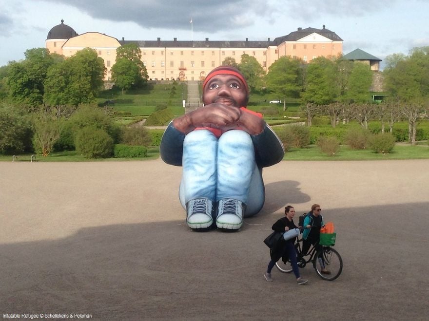 6m-high-artwork-Inflatable-Refugee-travels-the-world-57556199044ac__880