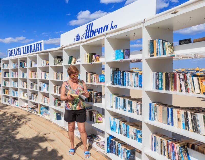 woman near free beach library opened black sea resort albena bulgaria 86390015