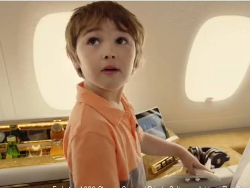 its-a-little-boy-named-cooper-playing-with-his-toy-airplane-he-tells-aniston-hes-about-to-begin-his-journey-back-to-his-own-seat