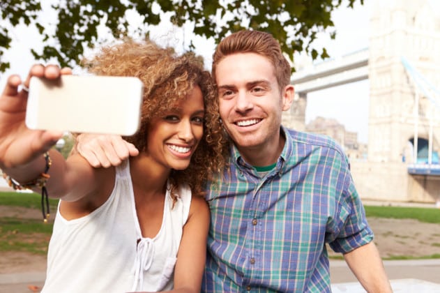 Couple Taking Selfie By Tower Bridge In London