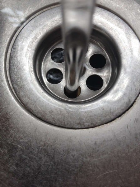 the-water-from-the-tap-and-the-plug-hole-photo-u1