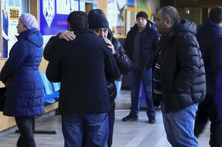 In this video grab provided by the ORSK.RU web site, Relatives and friends of those on the Saratov Airlines airline plane An-148 flight that crashed near Moscow's airport Domodedovo comfort each other while gathering at an airport outside Orsk, Russia, Sunday, Feb. 11, 2018. A Russian passenger plane carrying 71 people crashed Sunday near Moscow, killing everyone aboard shortly after the jet took off from one of the city's airports. The Saratov Airlines regional jet disappeared from radar screens a few minutes after departing from Domodedovo Airport en route to Orsk, a city some 1,500 kilometers (1,000 miles) southeast of Moscow. (Orsk.ru via AP)