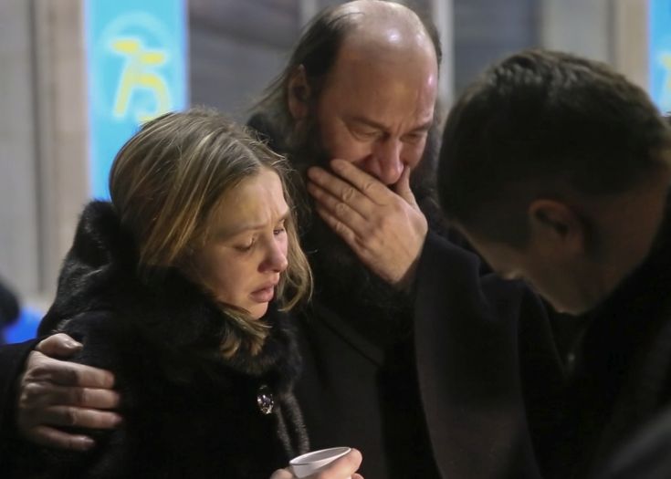 In this video grab provided by the ORSK.RU web site, Relatives and friends of those on the Saratov Airlines airline plane An-148 flight that crashed near Moscow's airport Domodedovo comfort each other while gathering at an airport outside Orsk, Russia, Sunday, Feb. 11, 2018. A Russian passenger plane carrying 71 people crashed Sunday near Moscow, killing everyone aboard shortly after the jet took off from one of the city's airports. The Saratov Airlines regional jet disappeared from radar screens a few minutes after departing from Domodedovo Airport en route to Orsk, a city some 1,500 kilometers (1,000 miles) southeast of Moscow. (Orsk.ru via AP)