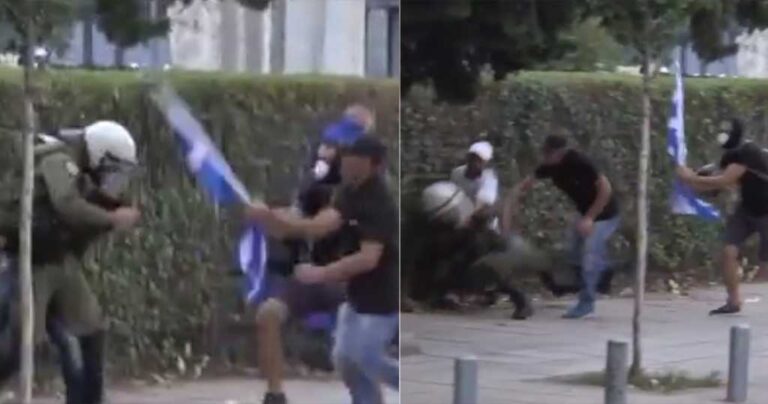 Θεσσαλονίκη: Διαδηλωτές έδειραν άντρα των ΜΑΤ με την ελληνική σημαία