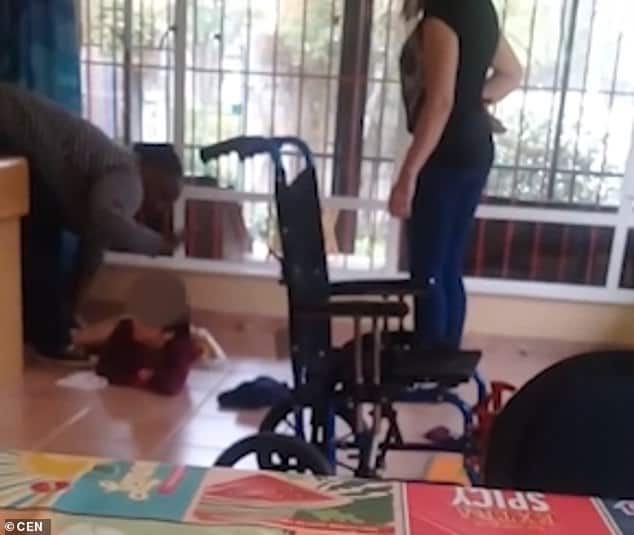 4944574 6264035 the nursery worker slaps the child on the back of the head while m 16 1539243415107