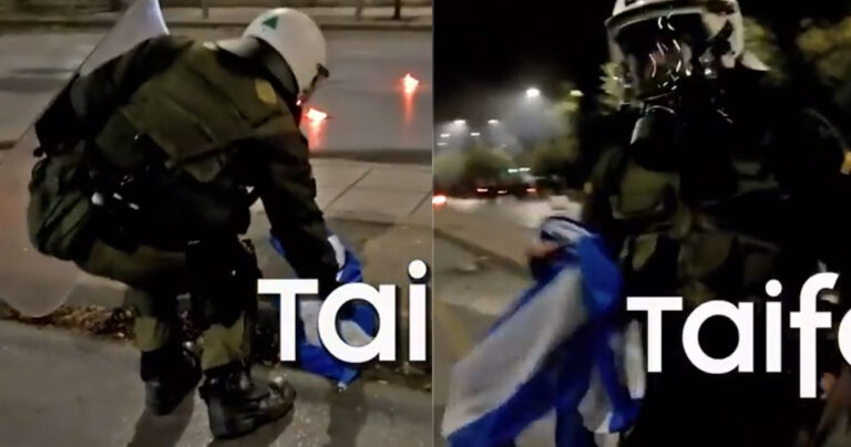 Αστυνομικός έσωσε την ελληνική σημαία από αναρχικούς που ήθελαν να την κάψουν