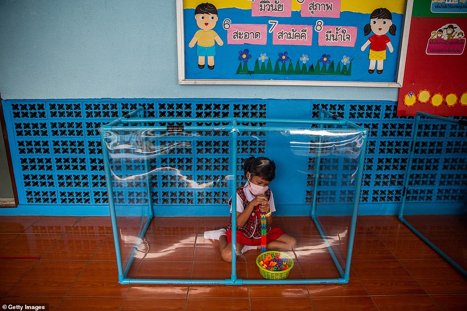 31769460 8611385 a child plays by herself with toys in screened in areas at the w a 13 1597068276233