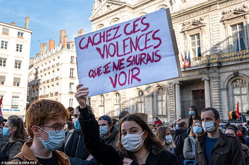 36208590 8996437 pictured a young demonstrator holds a sign that in english says a 54 1606598228384