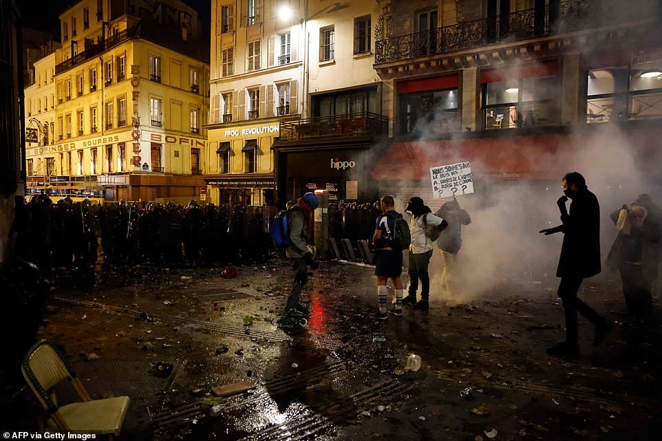 36209020 8996437 pictured a group of protesters face off against a line of riot p a 34 1606598224968