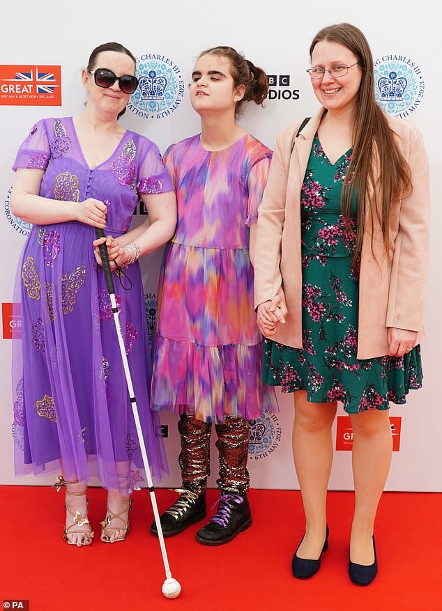 70702177 12057345 the blind musician centre looked lovely in a colourful chiffon f m 51 1683492319864
