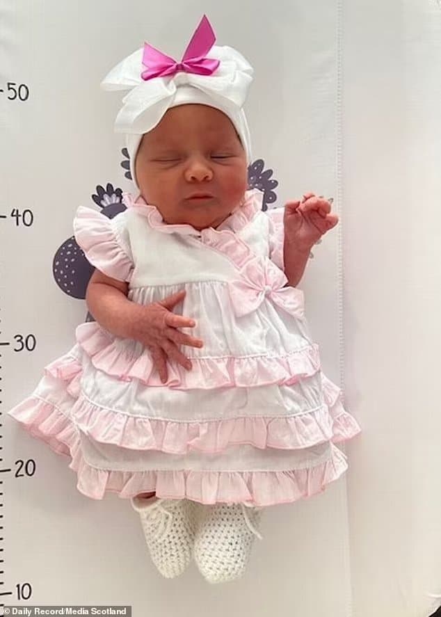 71694399 12151951 tiny daisy grace looking relaxed in a ruffled skirt after her bi a 188 1685710572172