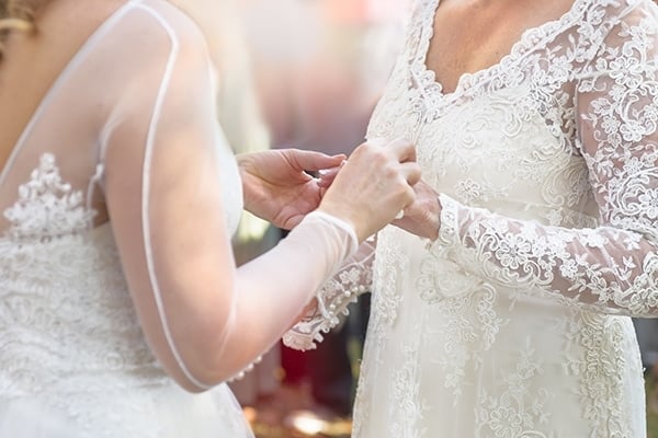 two women in wedding dresses share vows 329603