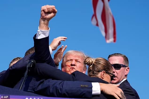 87484631 13650905 donald trump pictured narrowly avoided being killed by a gunman a 2 1721382008264