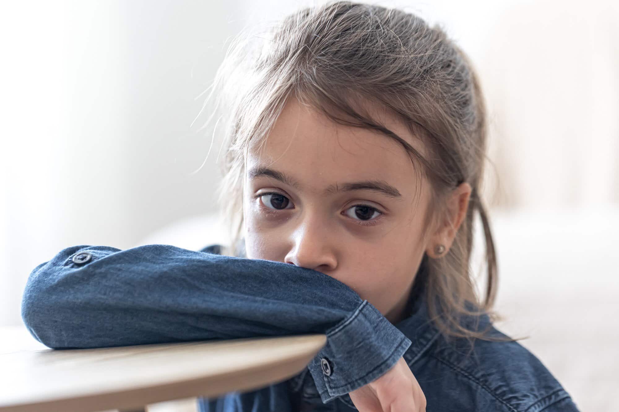 sad girl sitting table school back school concept 169016 13519