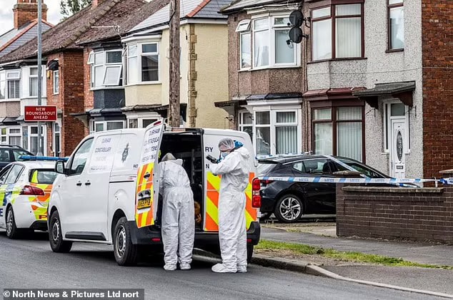 87061607 0 police in forensics gear stand next to a marked police van outsi a 7 1736875200449