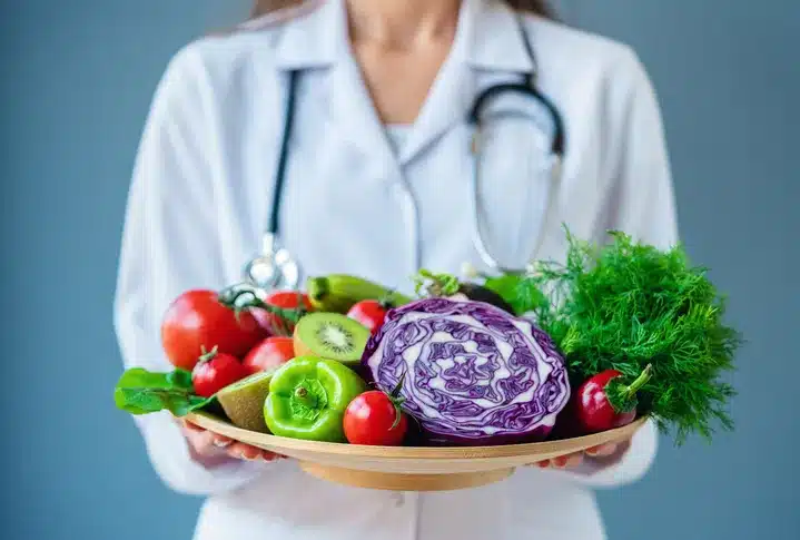 doctor holding fresh fruit in her hands1