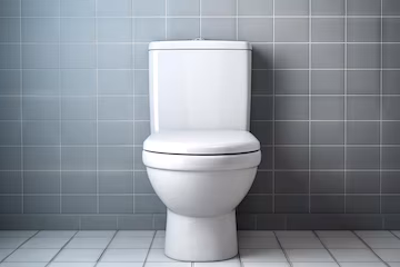 new white toilet installed tiled wall facing forward 908985 46236