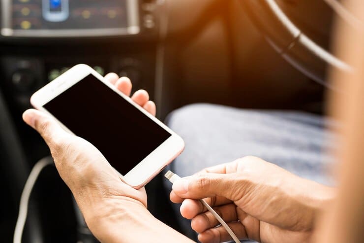 cropped hands person charging mobile phone car 1048944 27149067