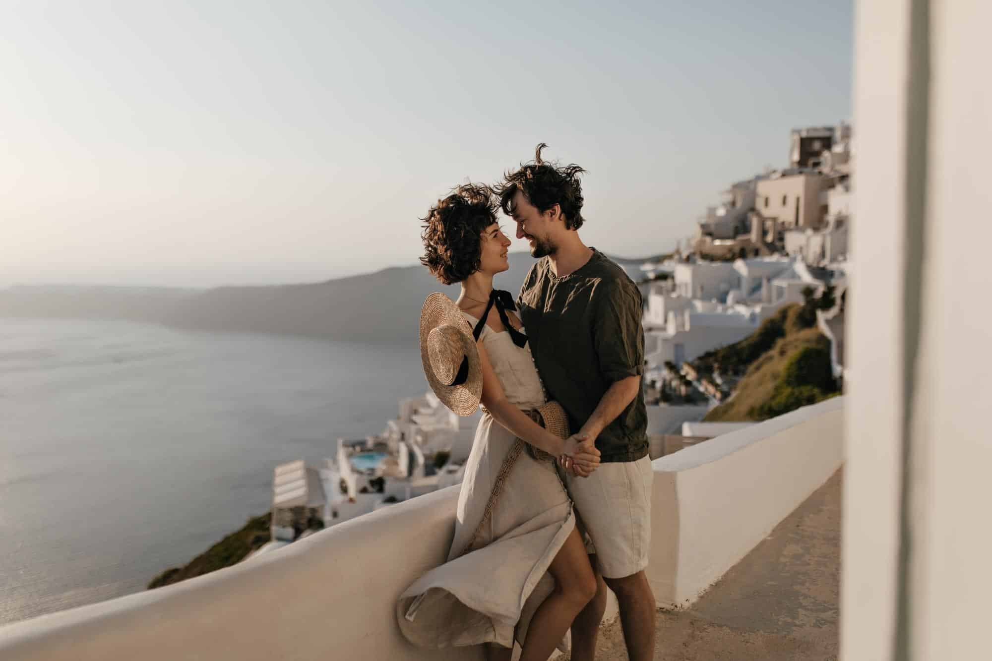 portrait couple background greek city brunette lady beige dress man stylish outfit looks each other with love sea background 197531 30063