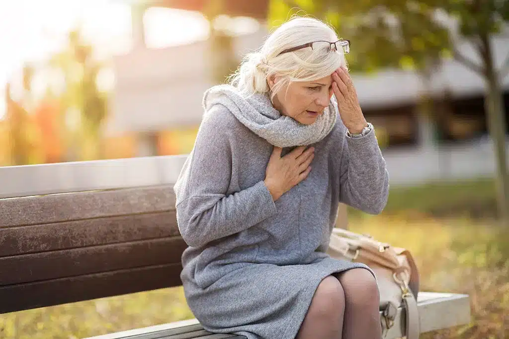 senior woman suffering from a headache