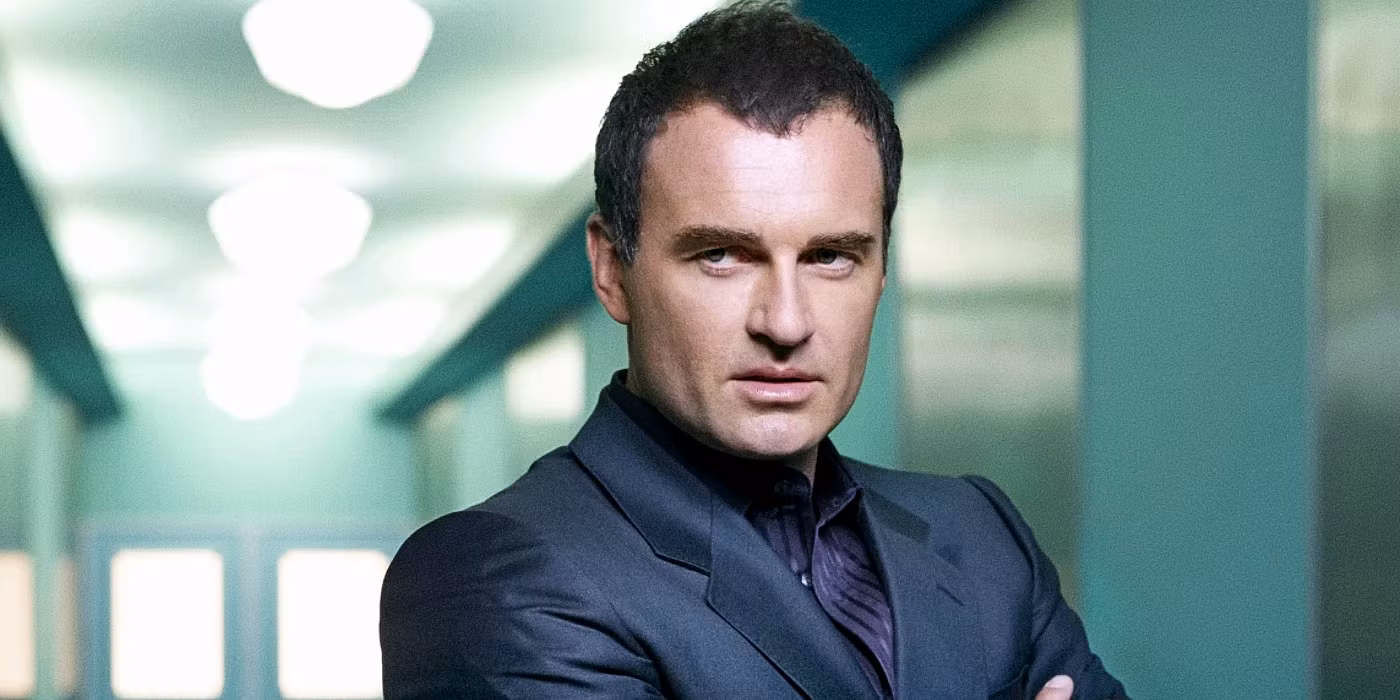 christian troy folds his arms in nip tuck
