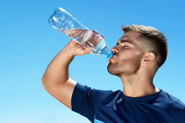 depositphotos 175382924 stock photo man drinking water after running