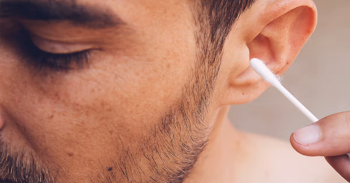 male man ear wax qtip 1200x628 facebook 1200x628 1