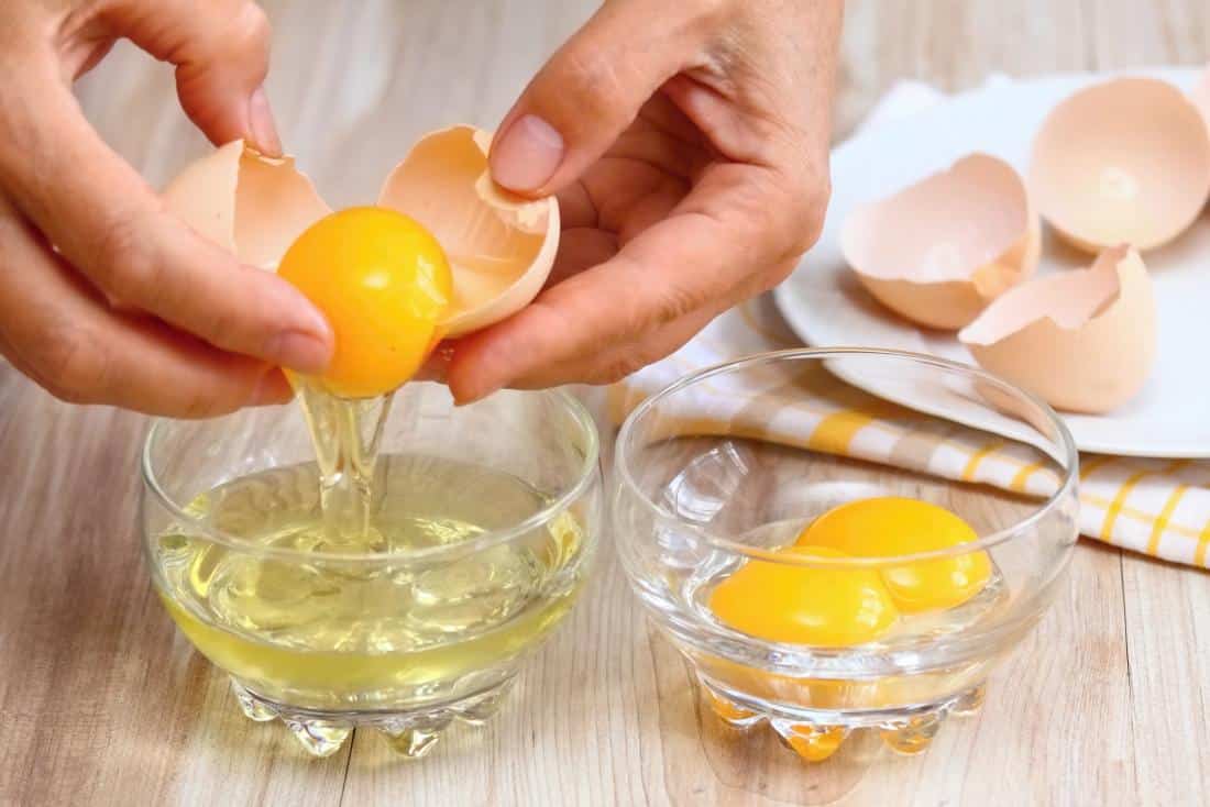 separating egg whites from egg yolks to make a face mask