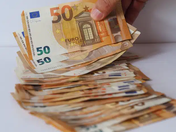 hand man counting 50 euro 704403530