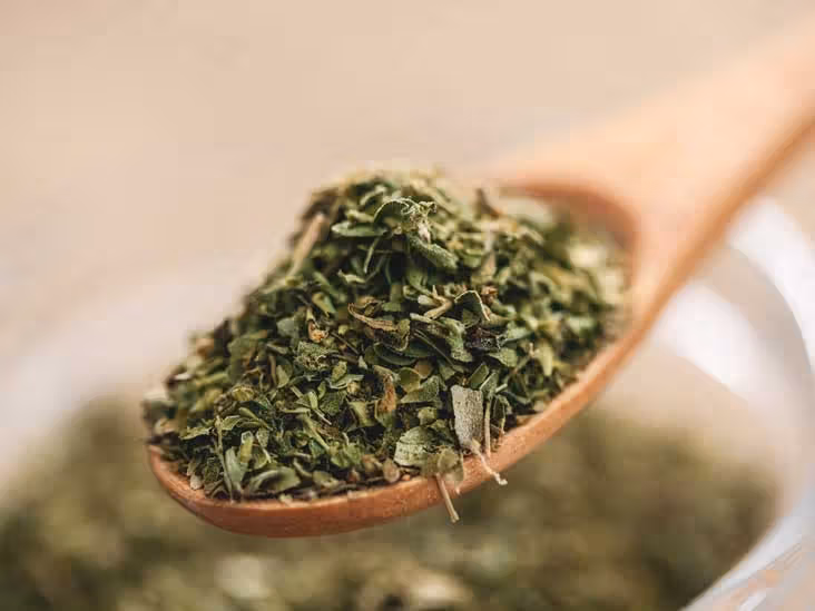 oregano flakes spoon thumb