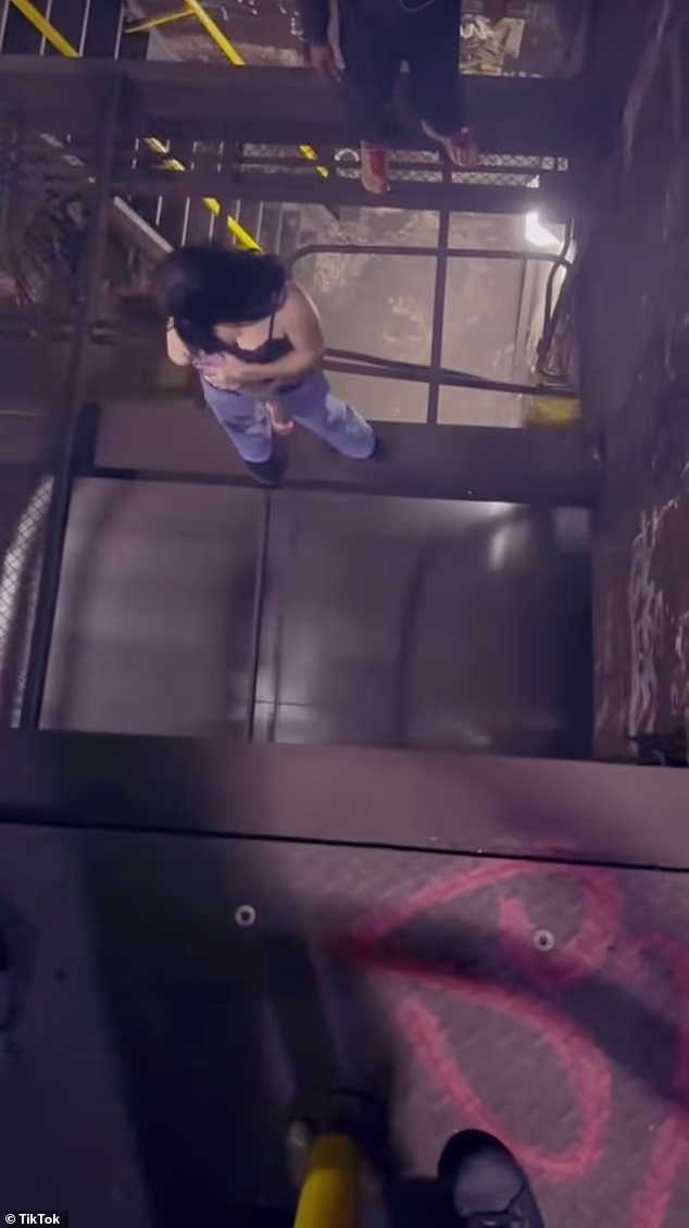 102786153 15170701 zemfira mukhtarov 12 was seen walking atop a beam as an incoming a 1 1759873553223