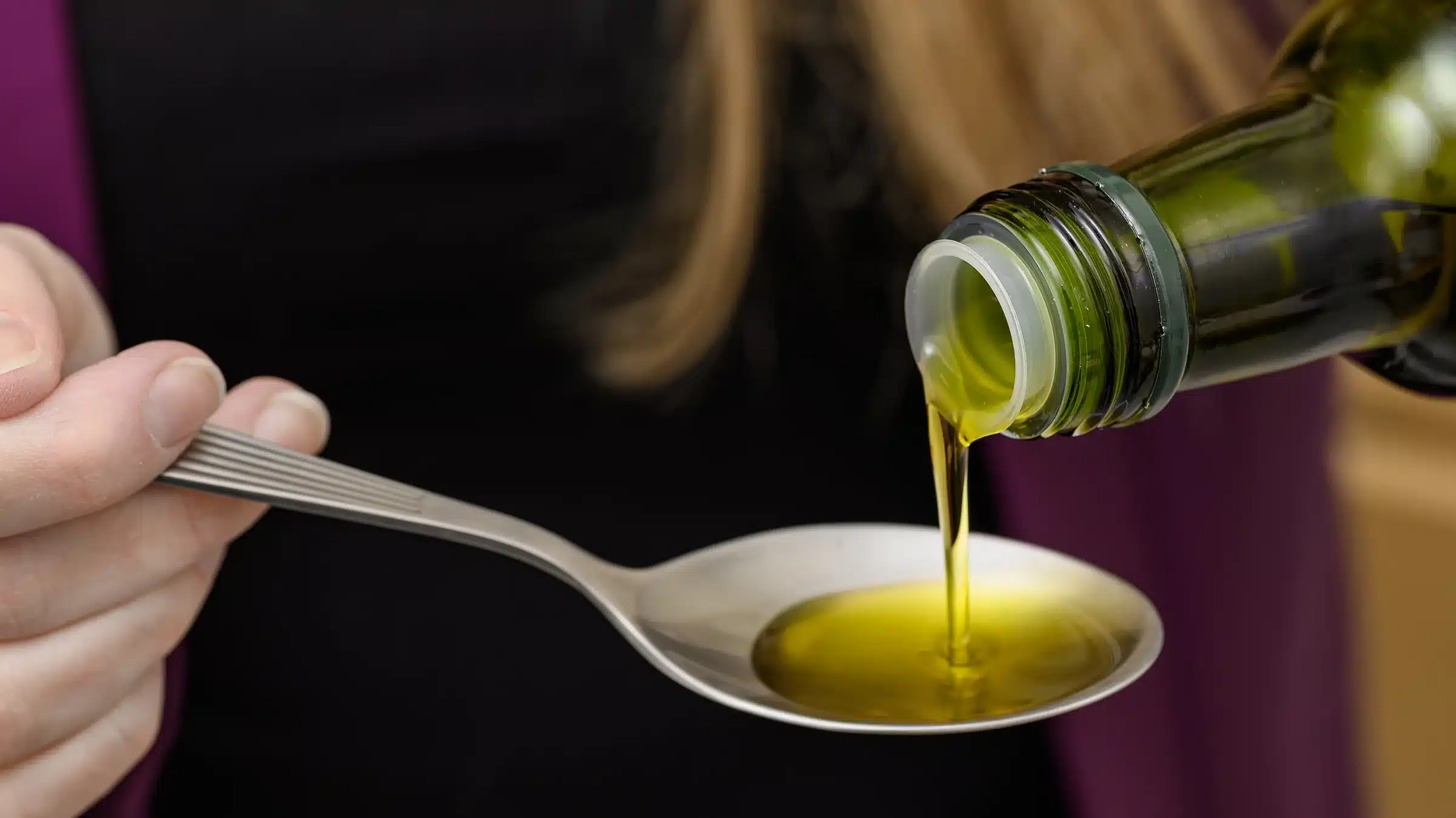 closeup spoonful olive oil 2233637248