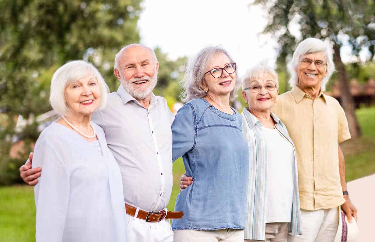 group of happy elderly people bonding outdoors at the park old people in the age of 60 70 80 having fun and spending time together concepts about elderly seniority and wellness aging dmdf02309